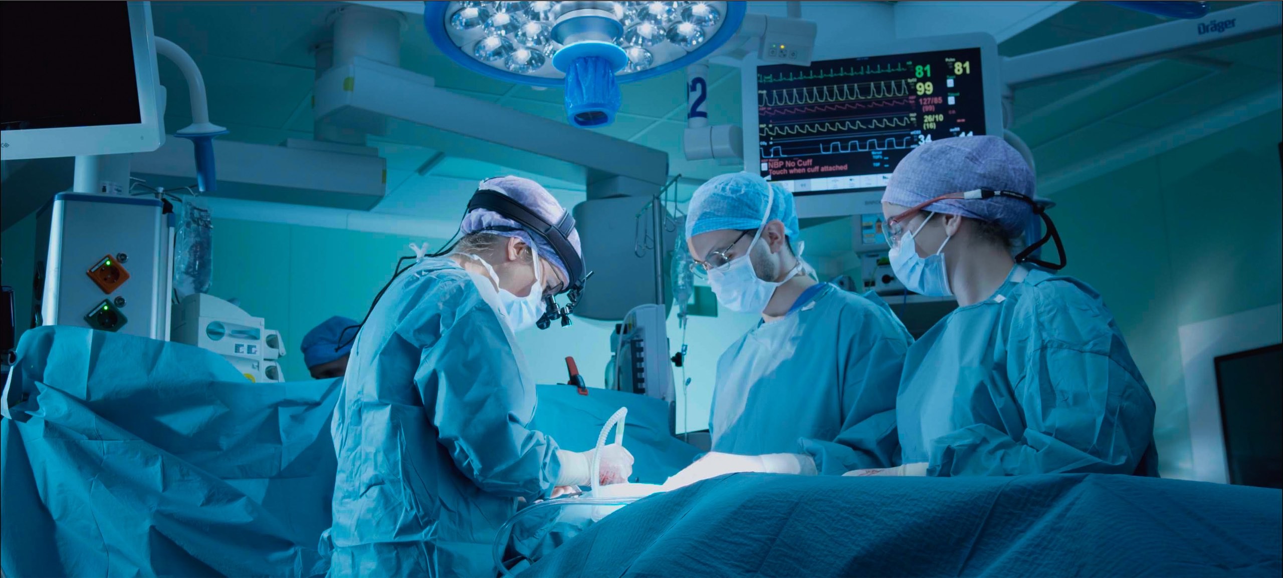 Surgeons doing surgery in an operating room.jpg